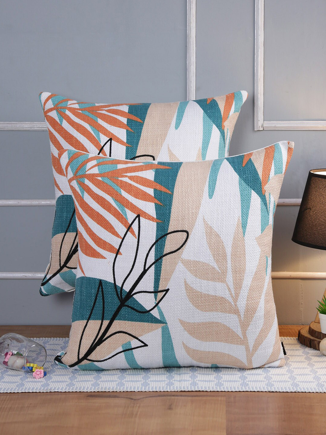 

Soumya White & Orange 2 Pieces Floral Square Cushion Covers