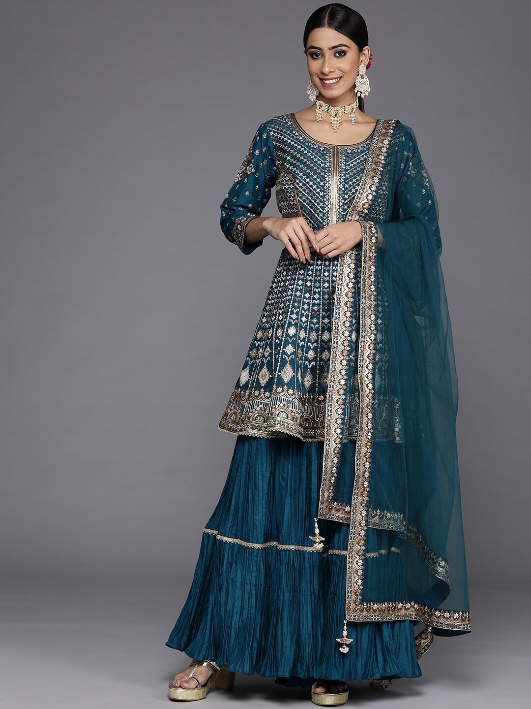 

Libas Teal & Gold-Toned Embroidered Sequinned Pure Silk Kurta with Sharara & Dupatta