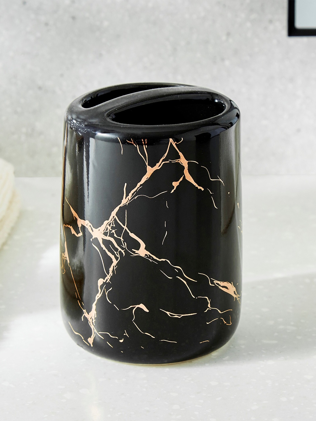 

Home Centre Aubree Vince Black & Gold Toned Printed Ceramic Tooth Brush Holder