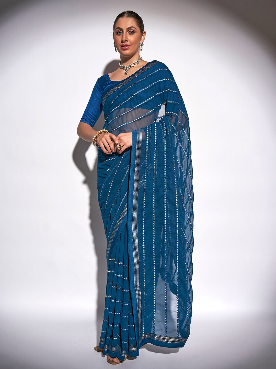 

Kalista Teal & Gold-Toned Embellished Mirror Work Pure Georgette Saree