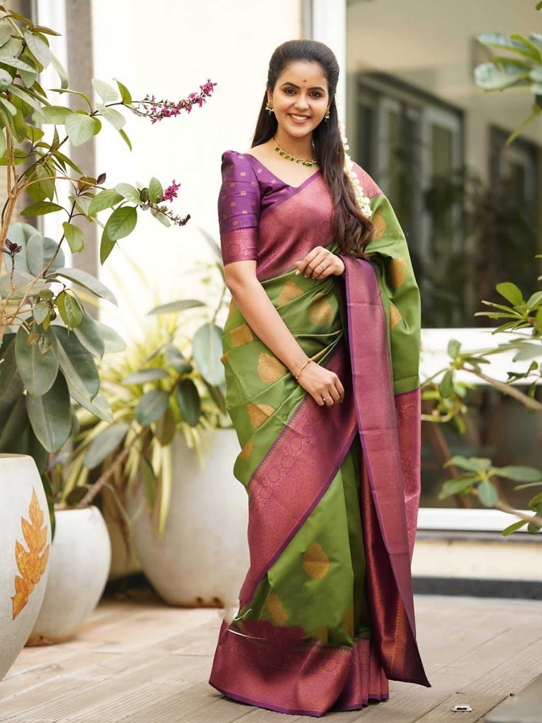 

Mitera Green & Purple Ethnic Woven Design Zari Silk Saree