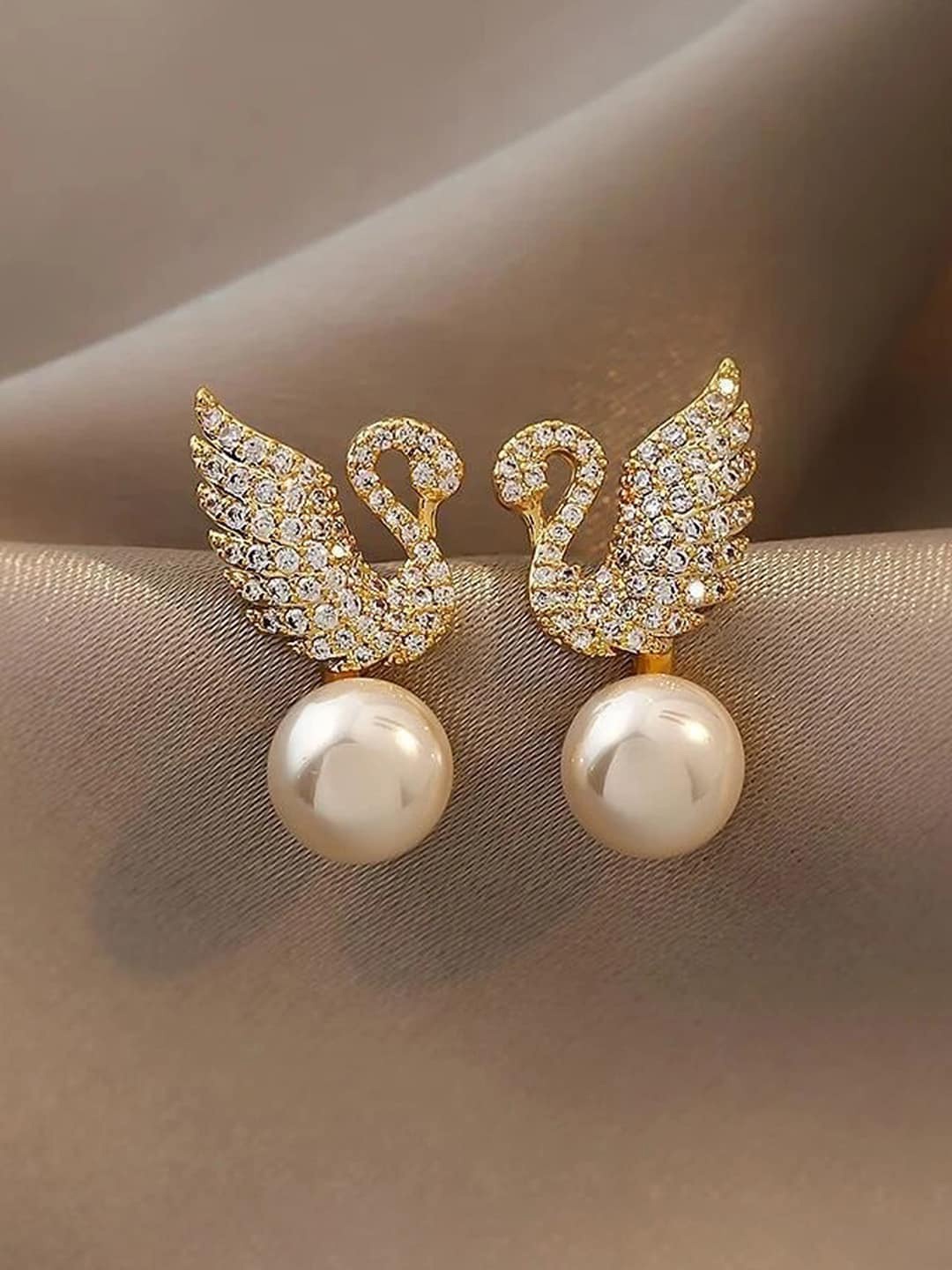 

Jewels Galaxy Gold-Plated Contemporary AD Studded Swan Shaped Studs Earrings