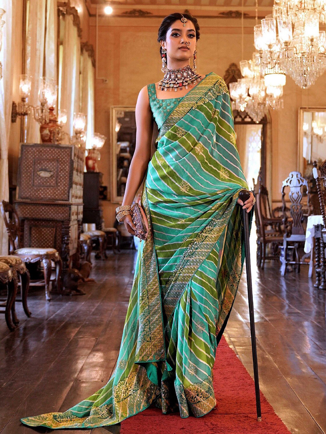 

Mitera Blue & Green Leheriya Printed Pure Georgette Saree