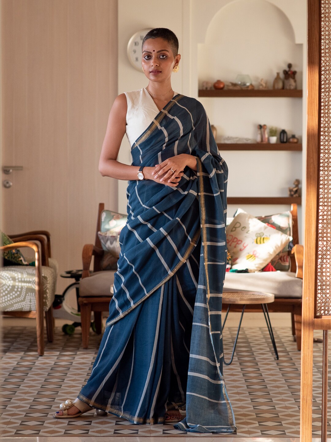 

Suta Blue & White Striped Zari Saree