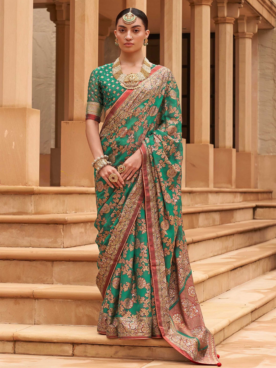 

Mitera Green & Red Ethnic Motif Zari Brasso Banarasi Saree With Blouse Piece