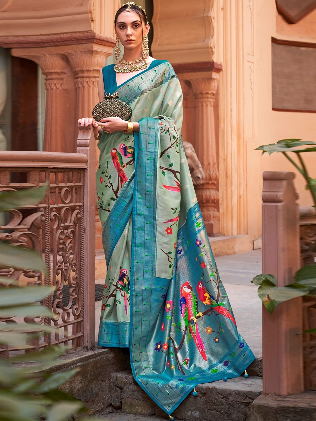 

Mitera Teal & Red Ethnic Motifs Zari Paithani Saree