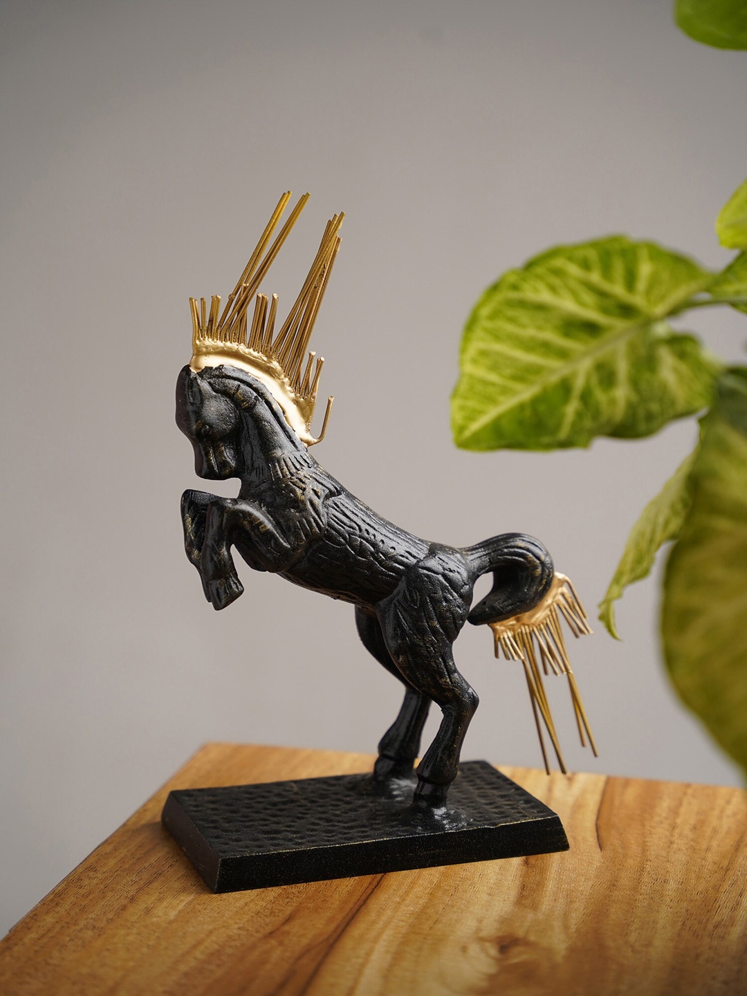 

Folkstorys Black & Gold-Toned Textured Horse Figurine Showpiece