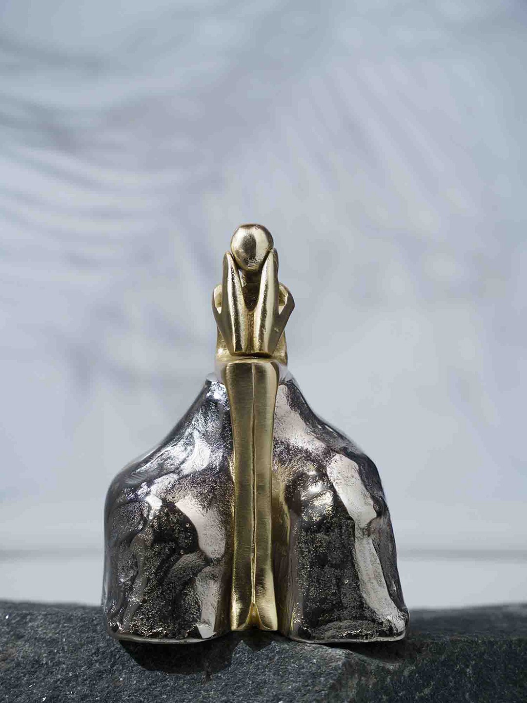 

Folkstorys Metallic-Toned The Man & The Rock Metal Showpiece, Gold