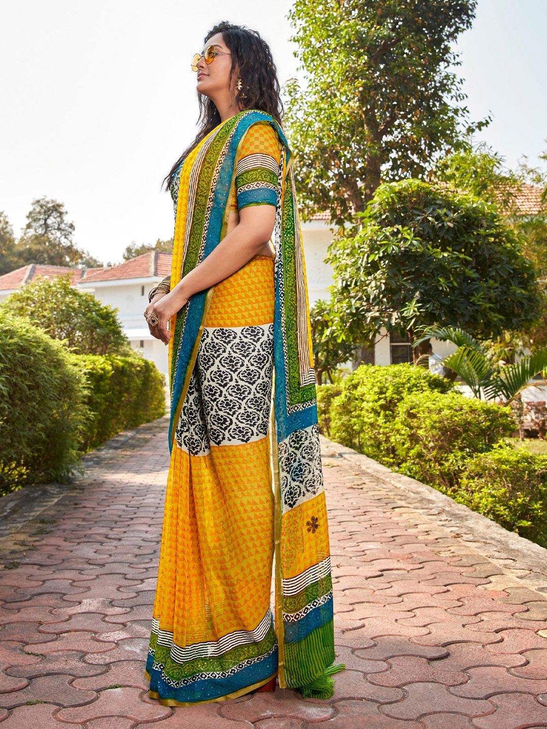DIVASTRI Ethnic Motifs Printed Embellished Saree, Yellow