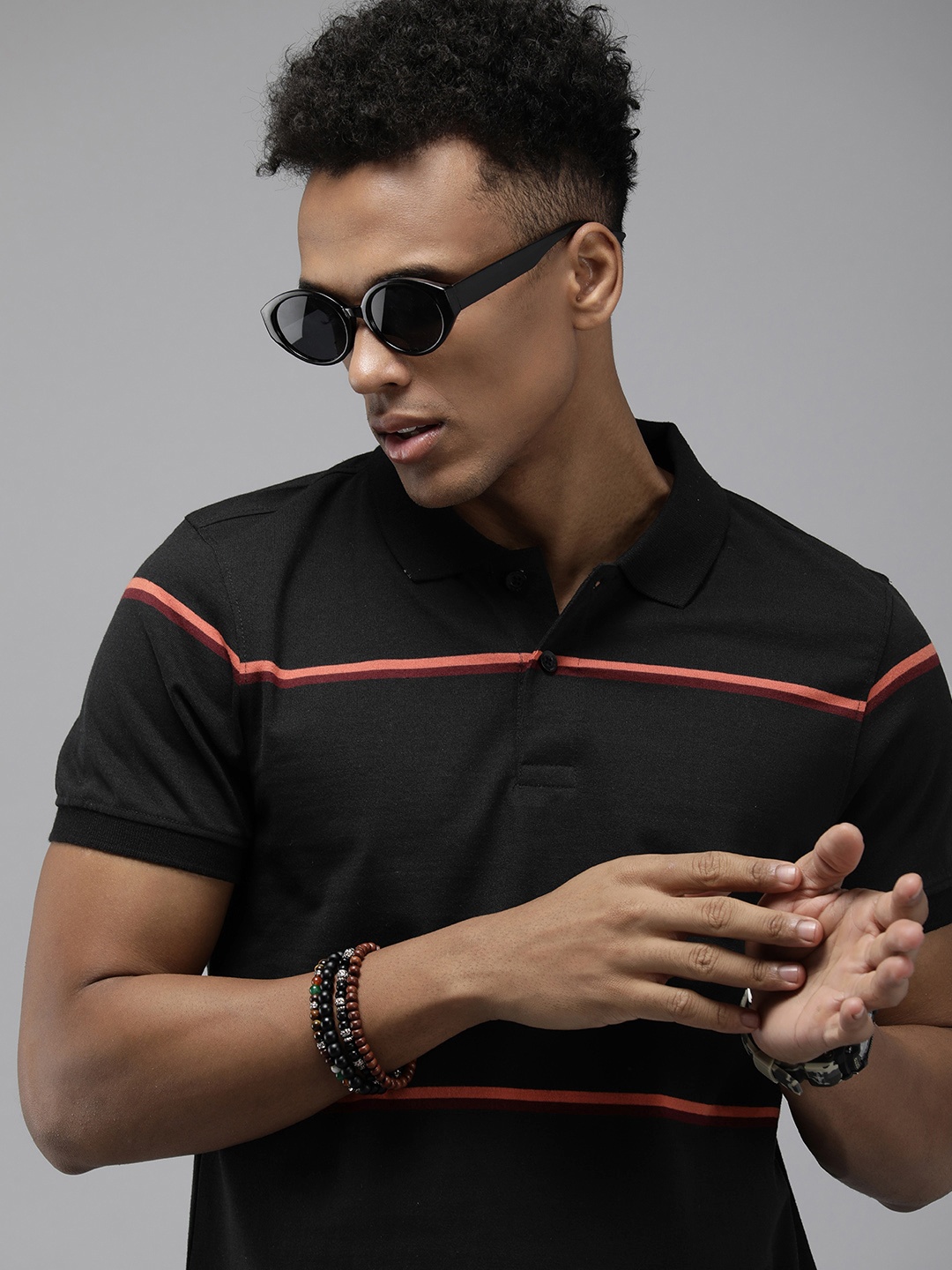 

Roadster Men Striped Polo Collar T-shirt, Black