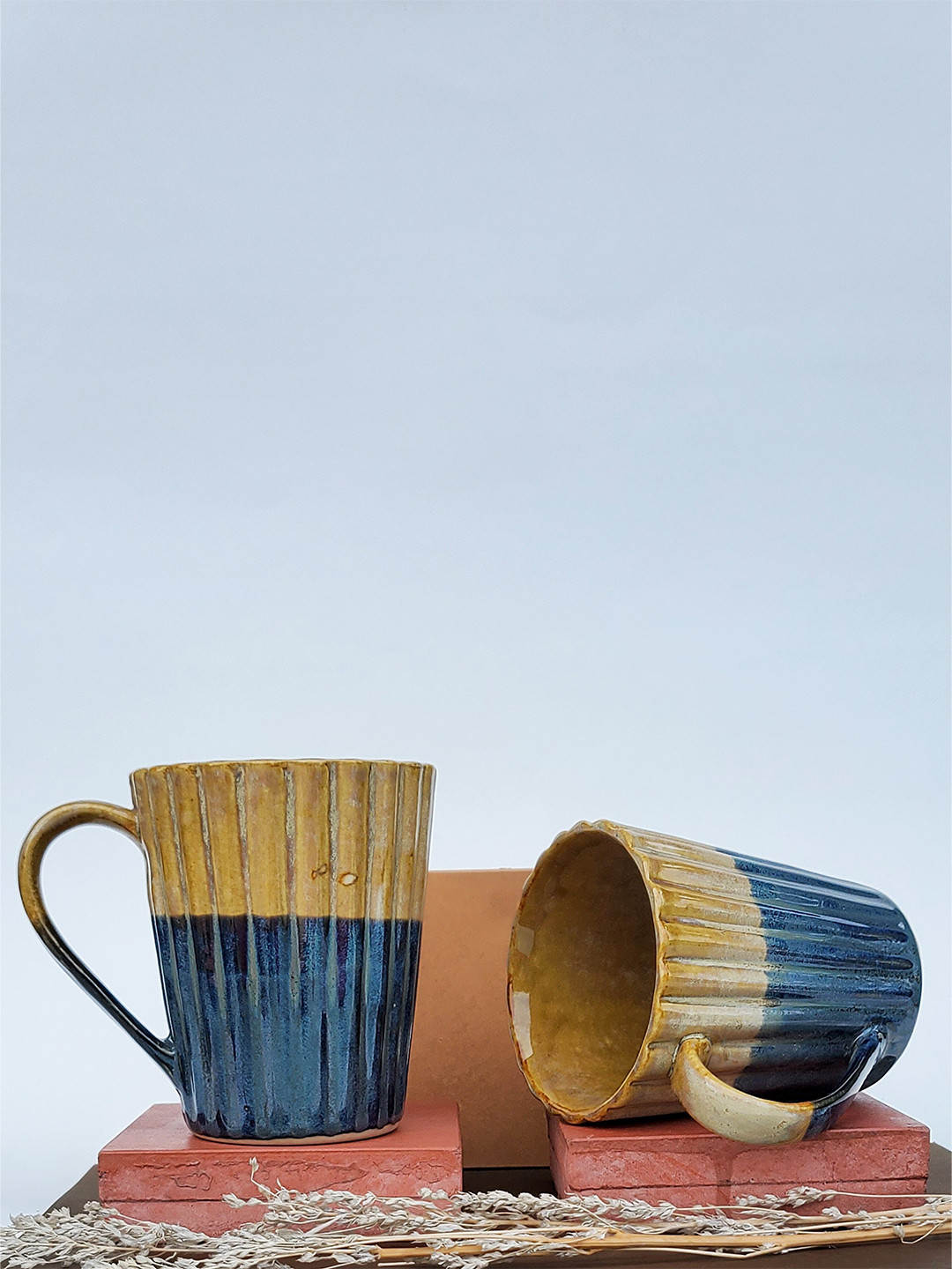 

Folkstorys Sunrise Yellow & Blue 2 Pieces Textured Ceramic Glossy Mugs