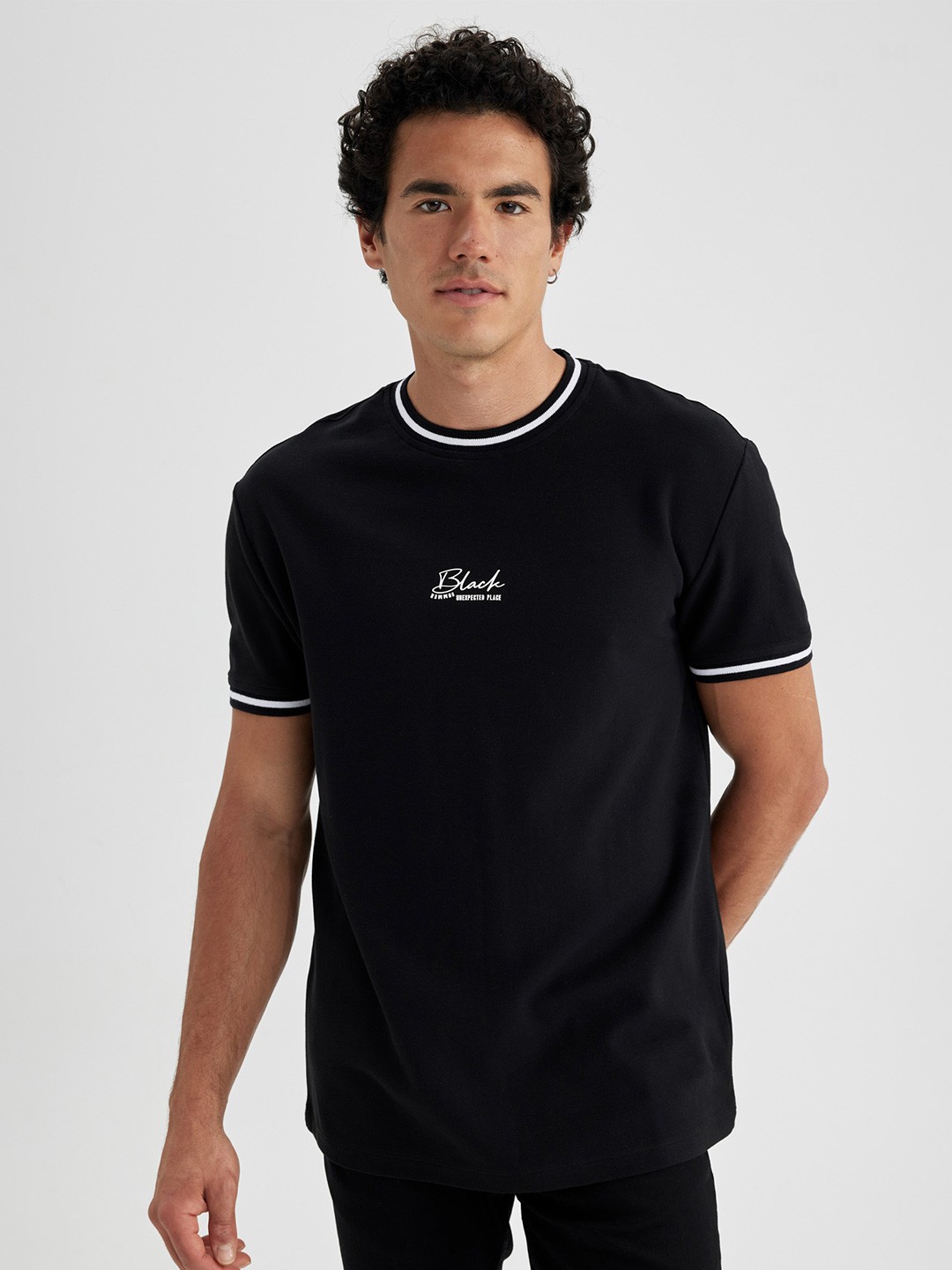 

DeFacto Men Solid Pure Cotton T-shirt, Black