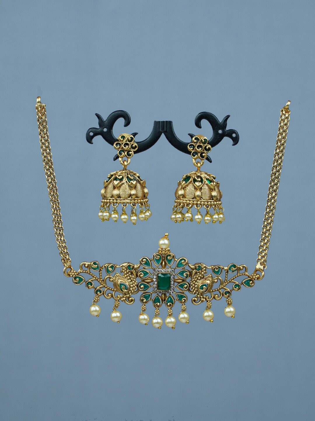 

Diksha collection Gold-Plated Stone Studded & Beaded Necklace & Earrings