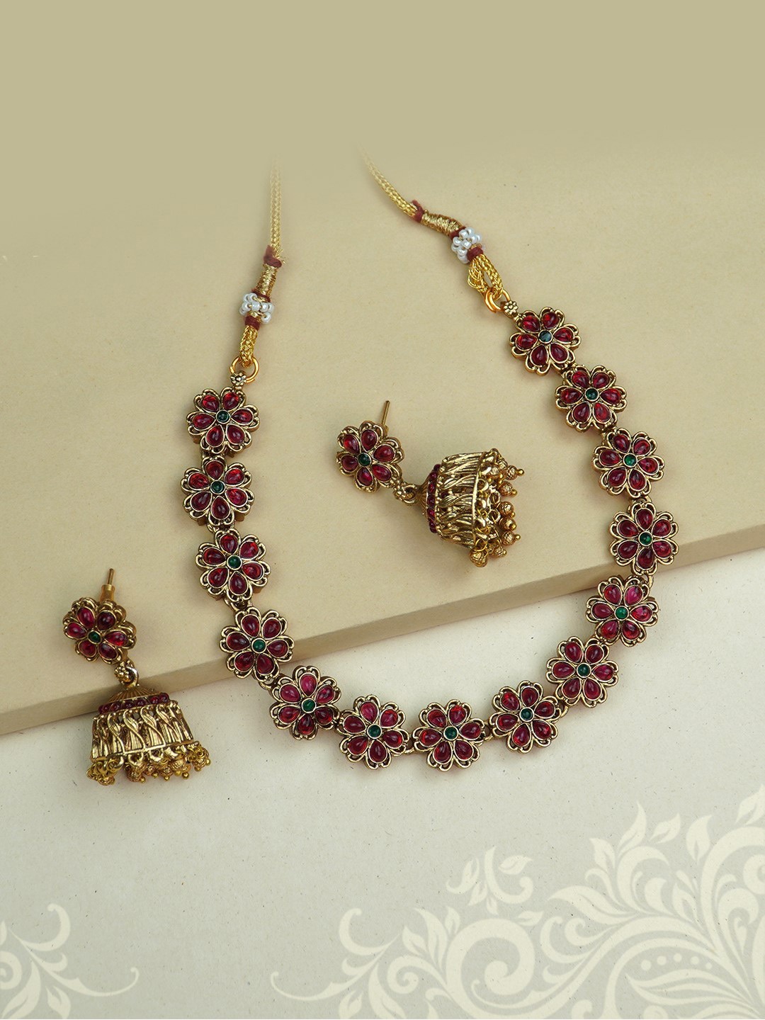 

Diksha collection Gold-Plated Stone Studded & Beaded Jewellery Set