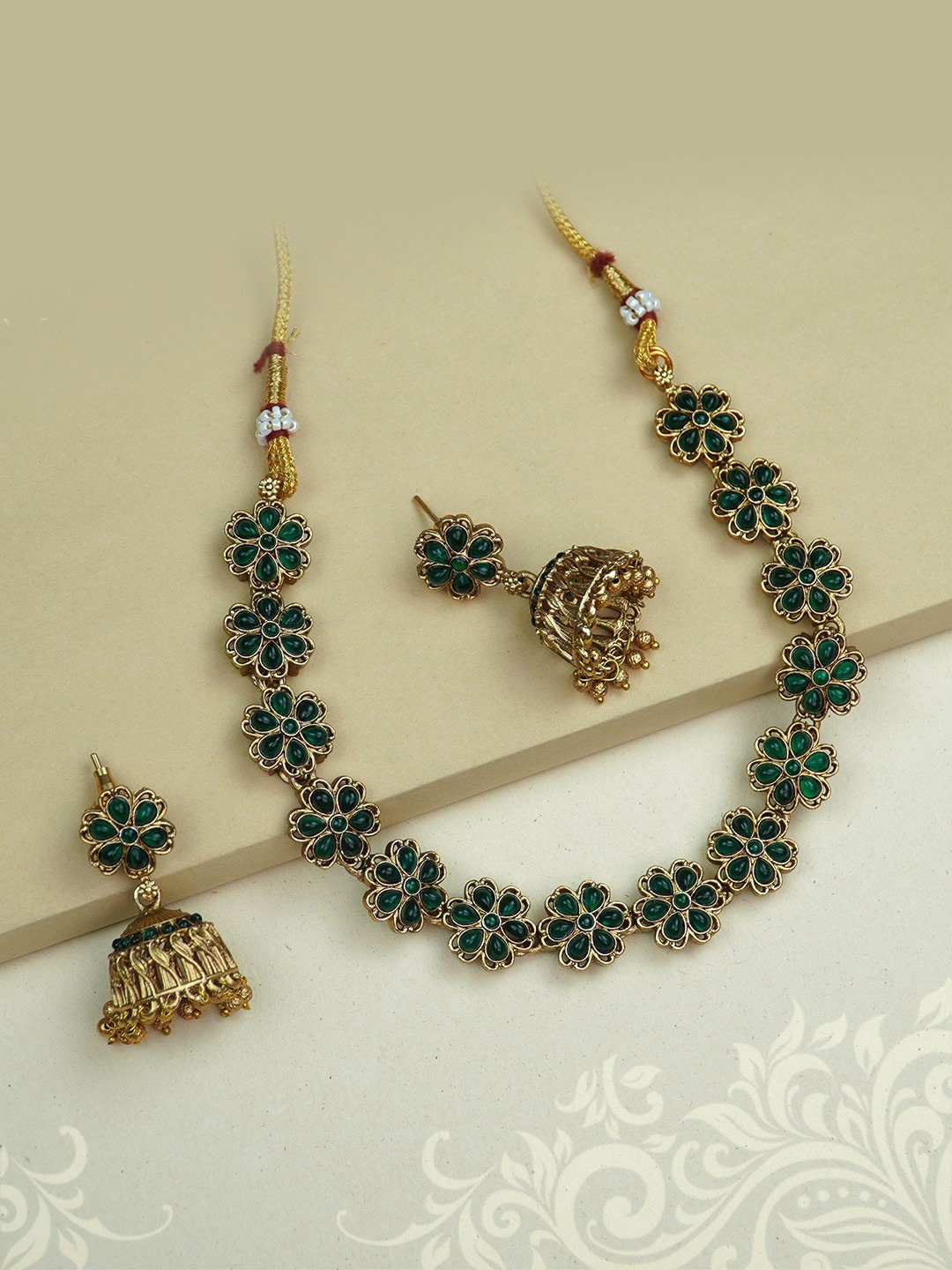 

Diksha collection Gold-Plated Stone Studded & Beaded Jewellery Set
