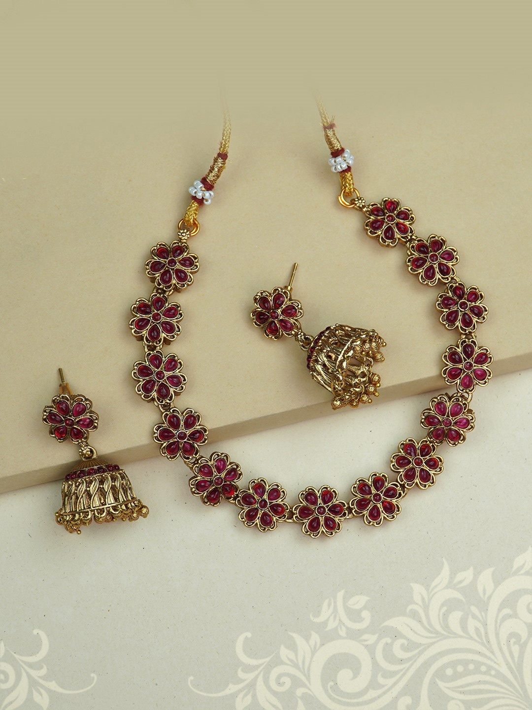 

Diksha collection Gold-Plated Stone Studded & Beaded Jewellery Set