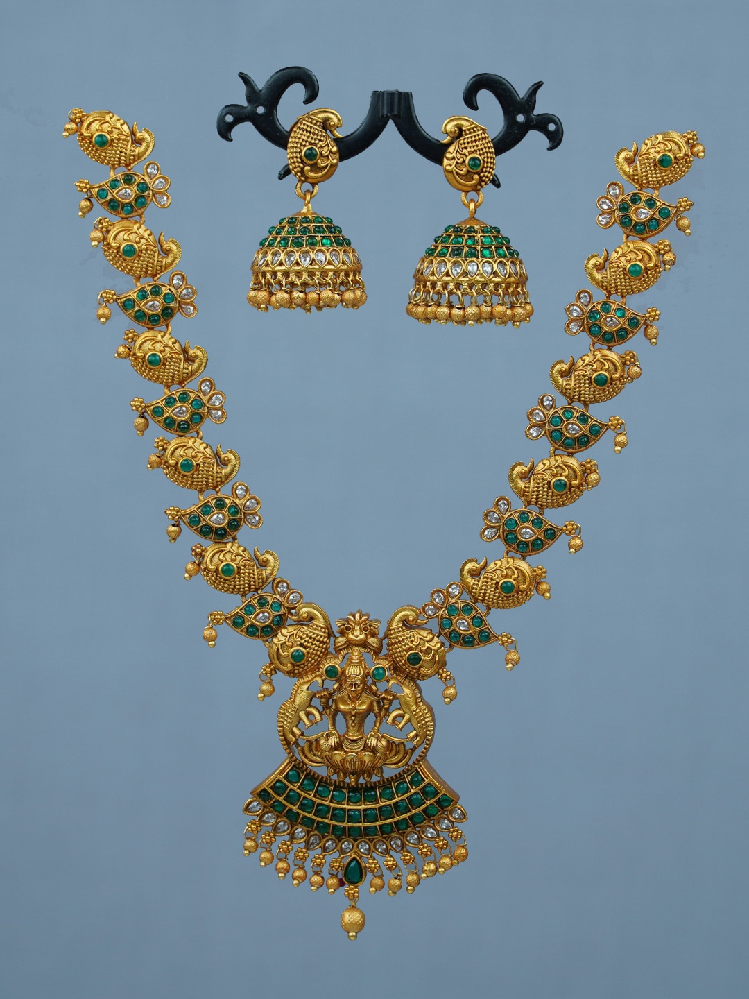 

Diksha collection Gold-Plated Stone Studded & Beaded Temple Necklace & Earrings