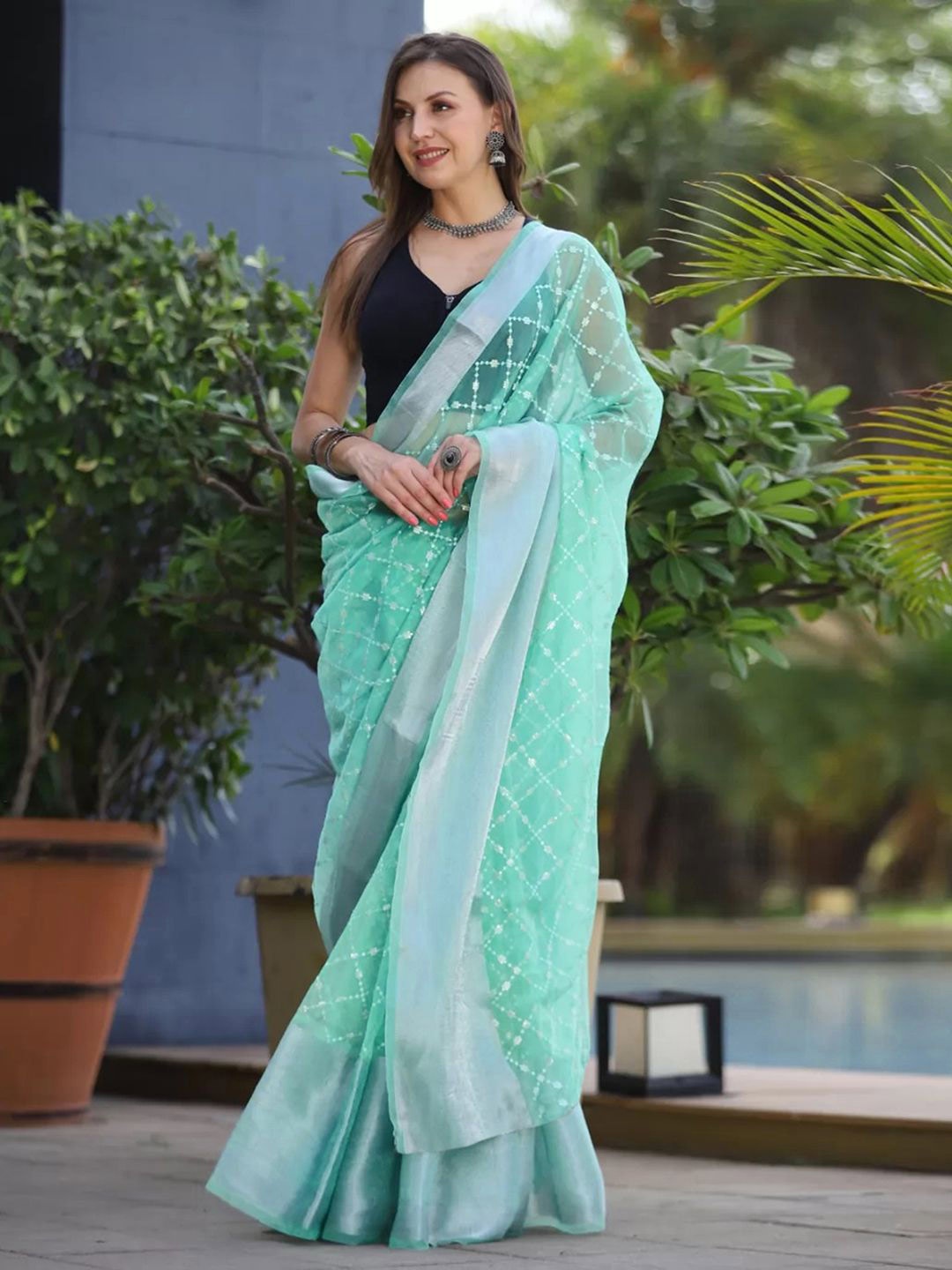 

Satrani Turquoise Blue Ethnic Woven Design Organza Saree