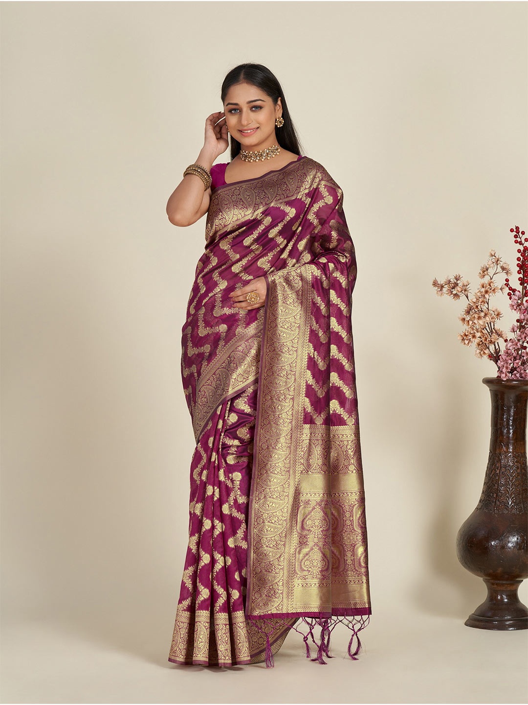 

Anouk Magenta & Gold-Toned Ethnic Motif Woven Design Zari Organza Saree