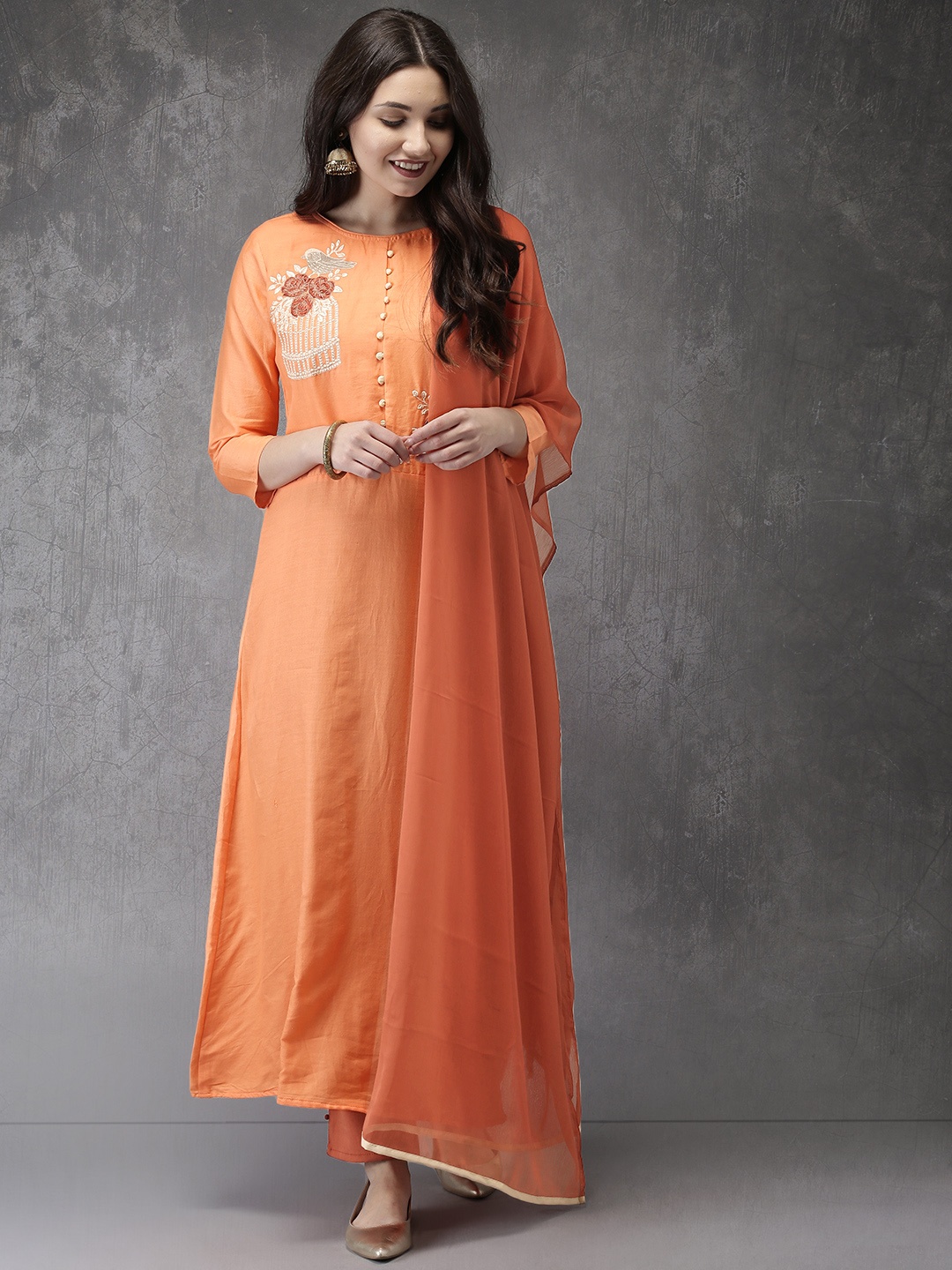 

Anouk Women Orange & Rust Red Solid Kurta with Trousers & Dupatta