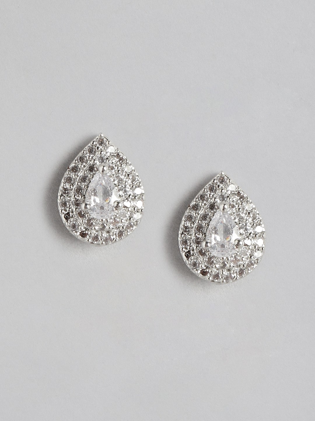 

Aadvik Designs Silver-Toned Teardrop Shaped AD Studded Studs Earrings