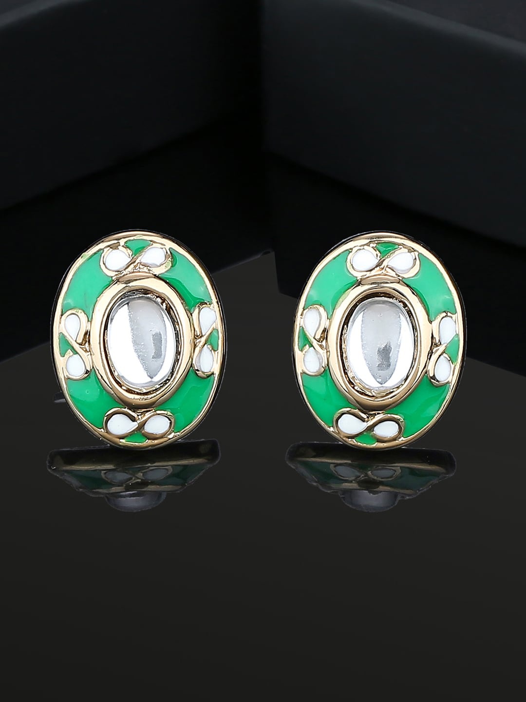 

Estele Gold Plated Oval Kundan Studded Studs Earrings