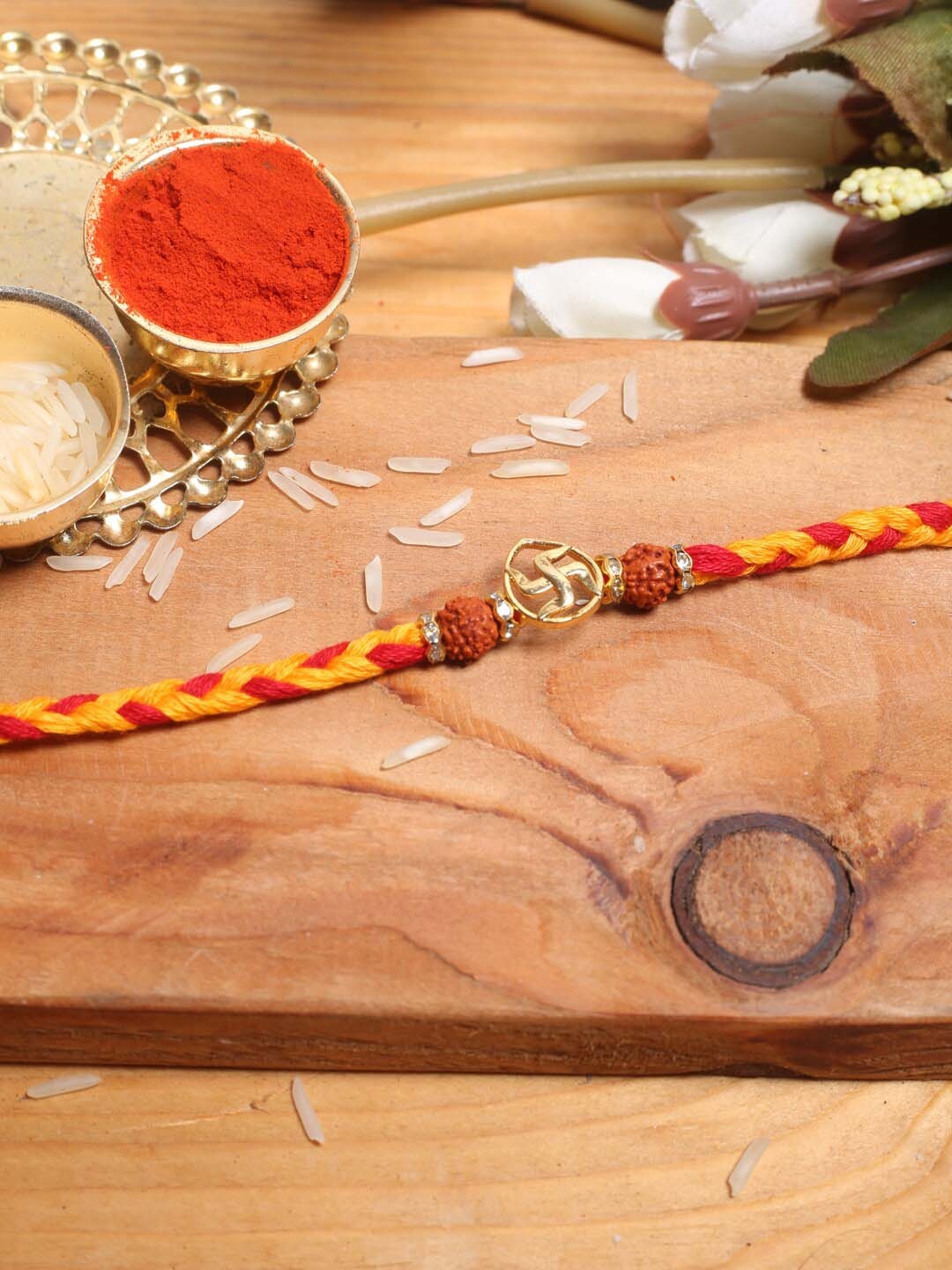 

Aapno Rajasthan Swastik Thread Rakhi With Roli Chawal, Yellow