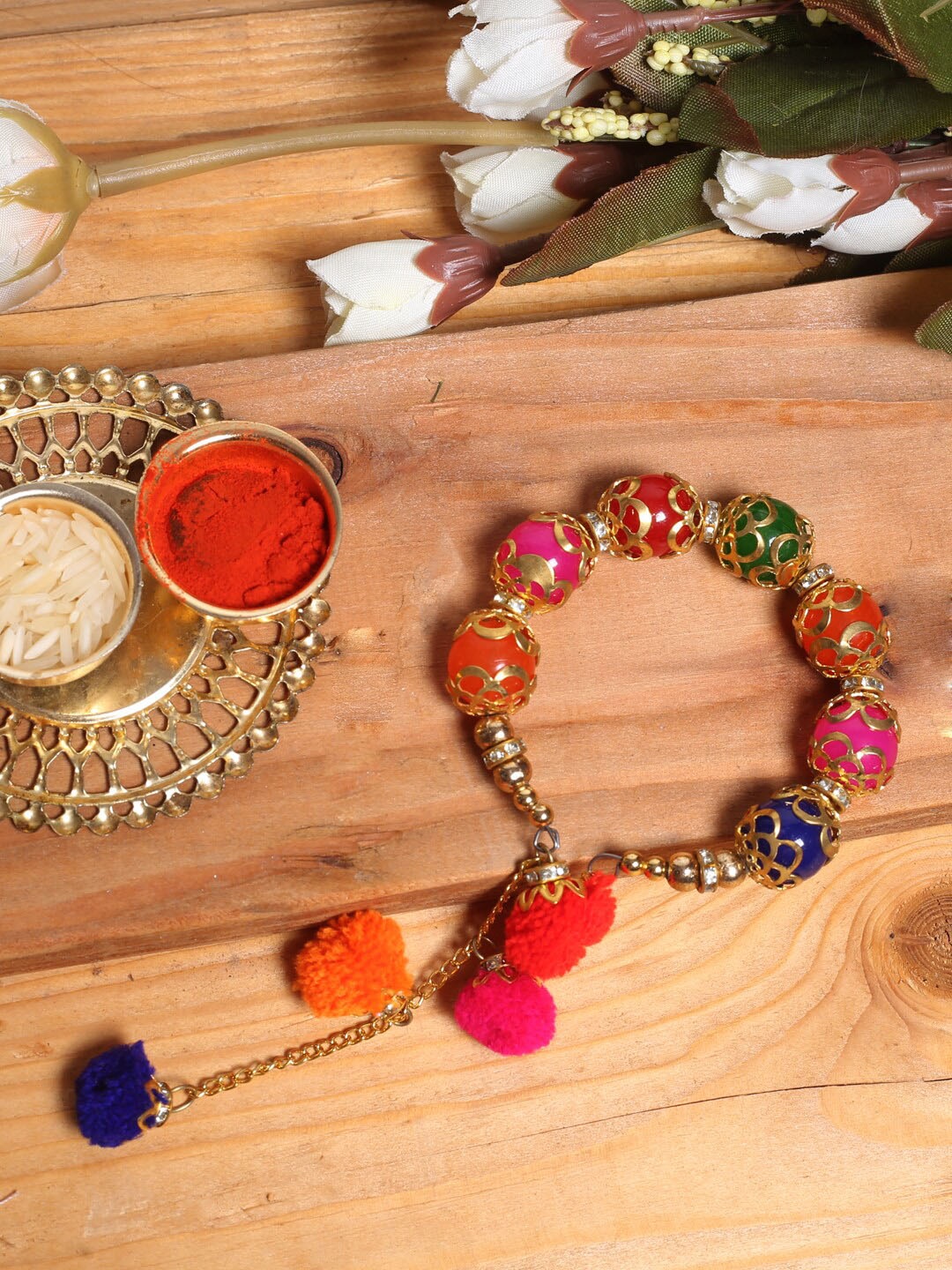 

Aapno Rajasthan Beaded Pom-Pom Bracelet Rakhi, Pink