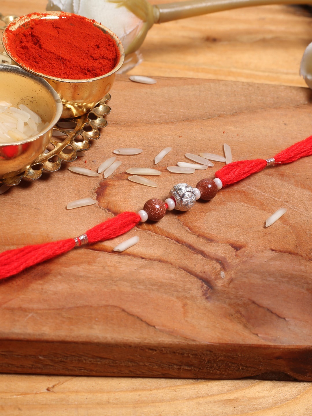 

Aapno Rajasthan Shimmer Beaded Rakhi, Red