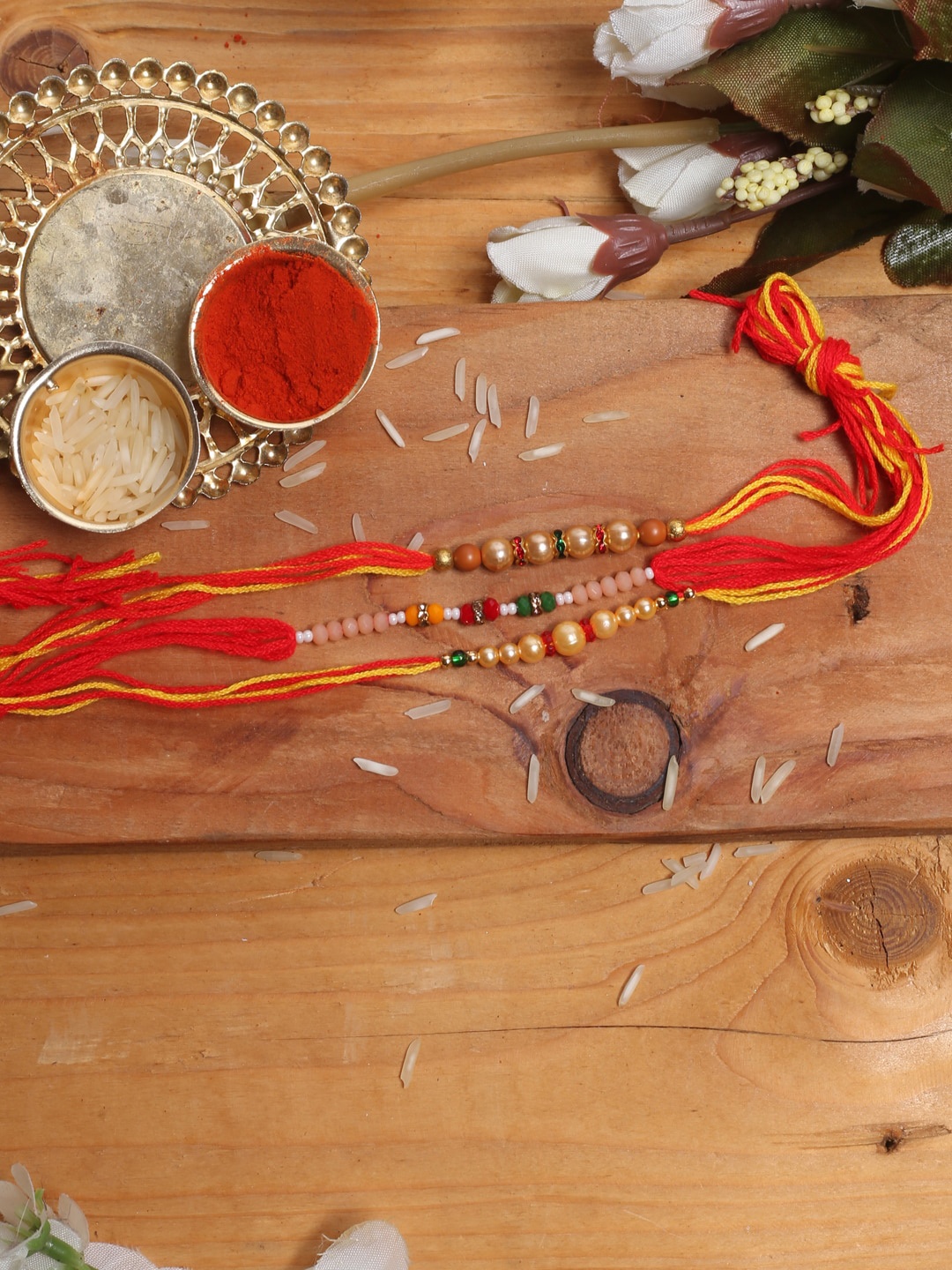 

Aapno Rajasthan Set Of 3 Thread Rakhi With Roli Chawal, Red