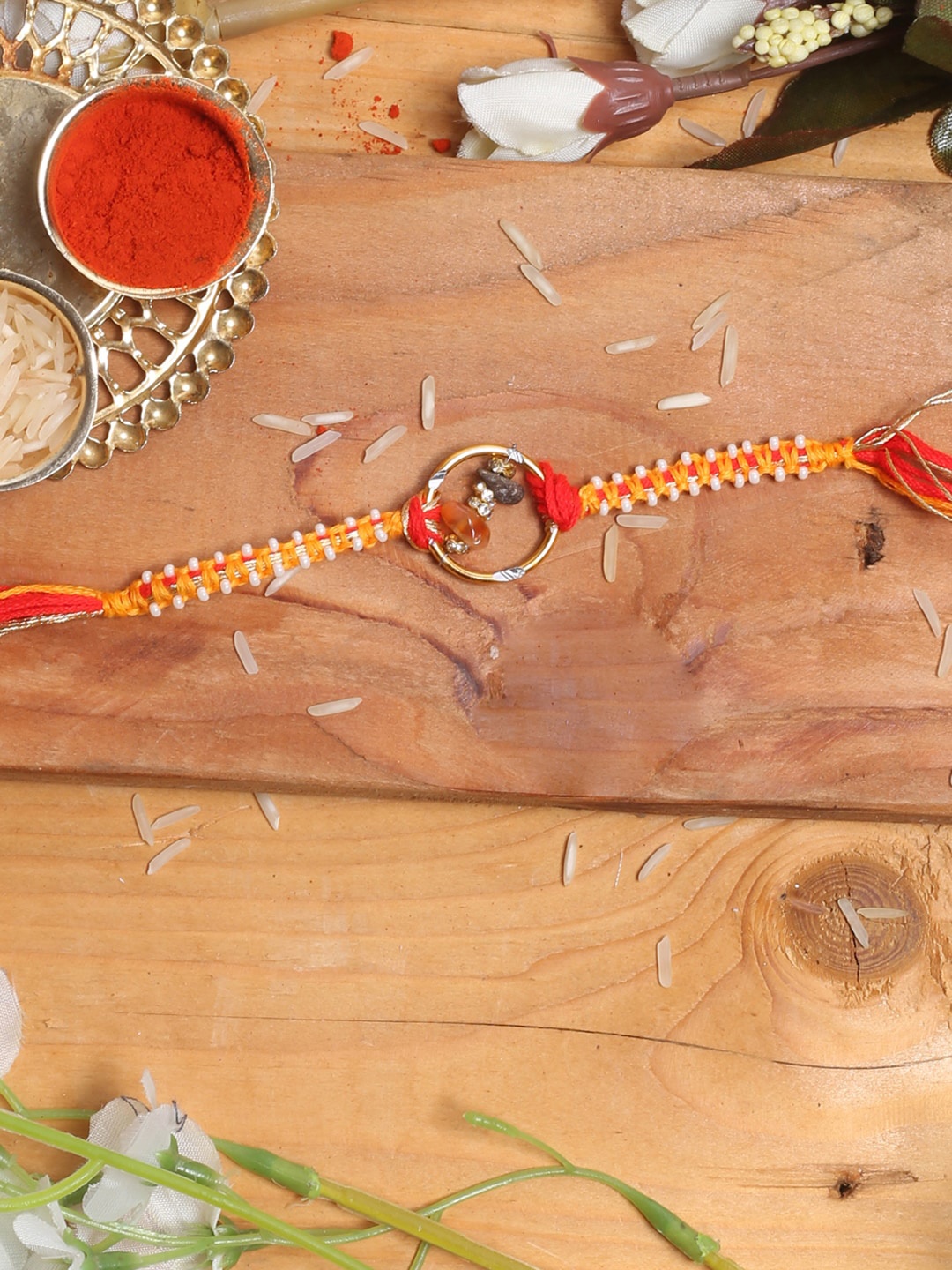 

Aapno Rajasthan Beaded Thread Rakhi With Roli Chawal, Gold