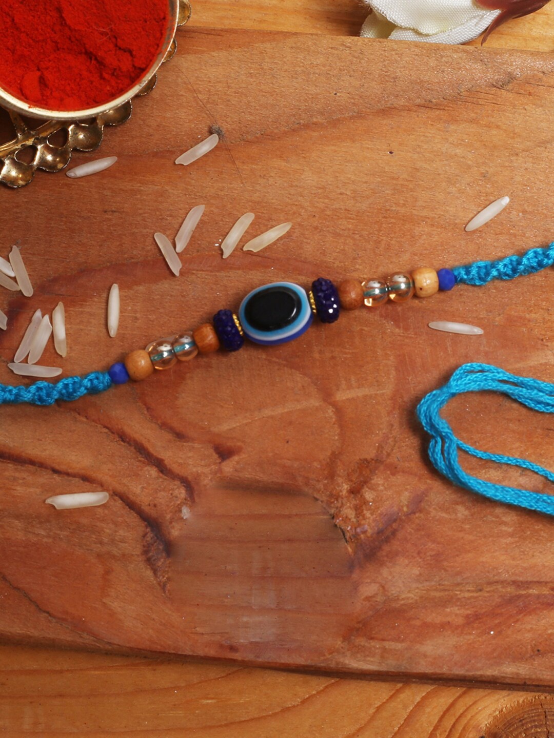 

Aapno Rajasthan Evil Eye Beaded Thread Rakhi With Roli Chawal, Blue