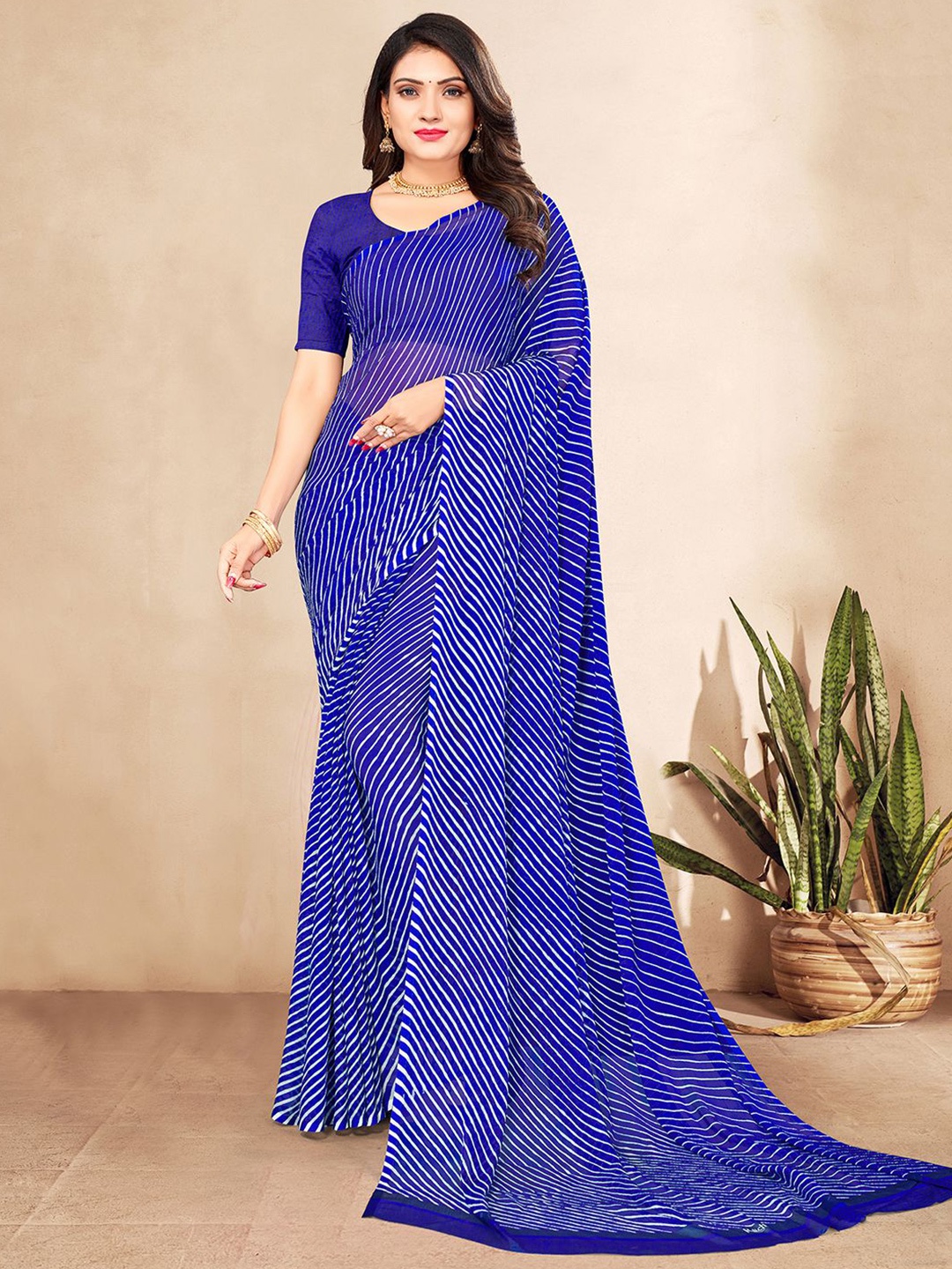 

Mitera Navy Blue & White Leheriya Poly Chiffon Saree With Blouse Piece