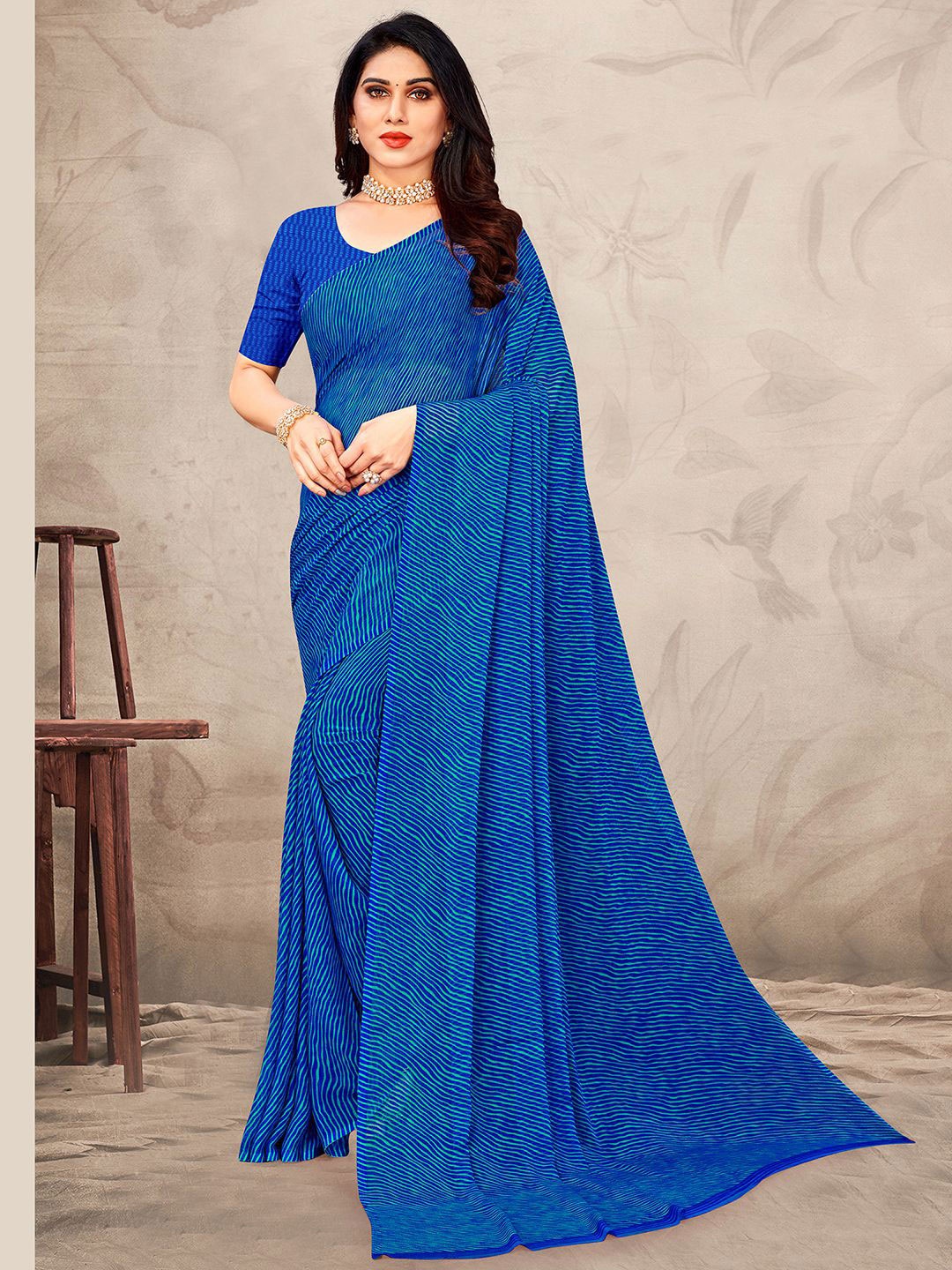 

Mitera Blue Leheriya Printed Saree