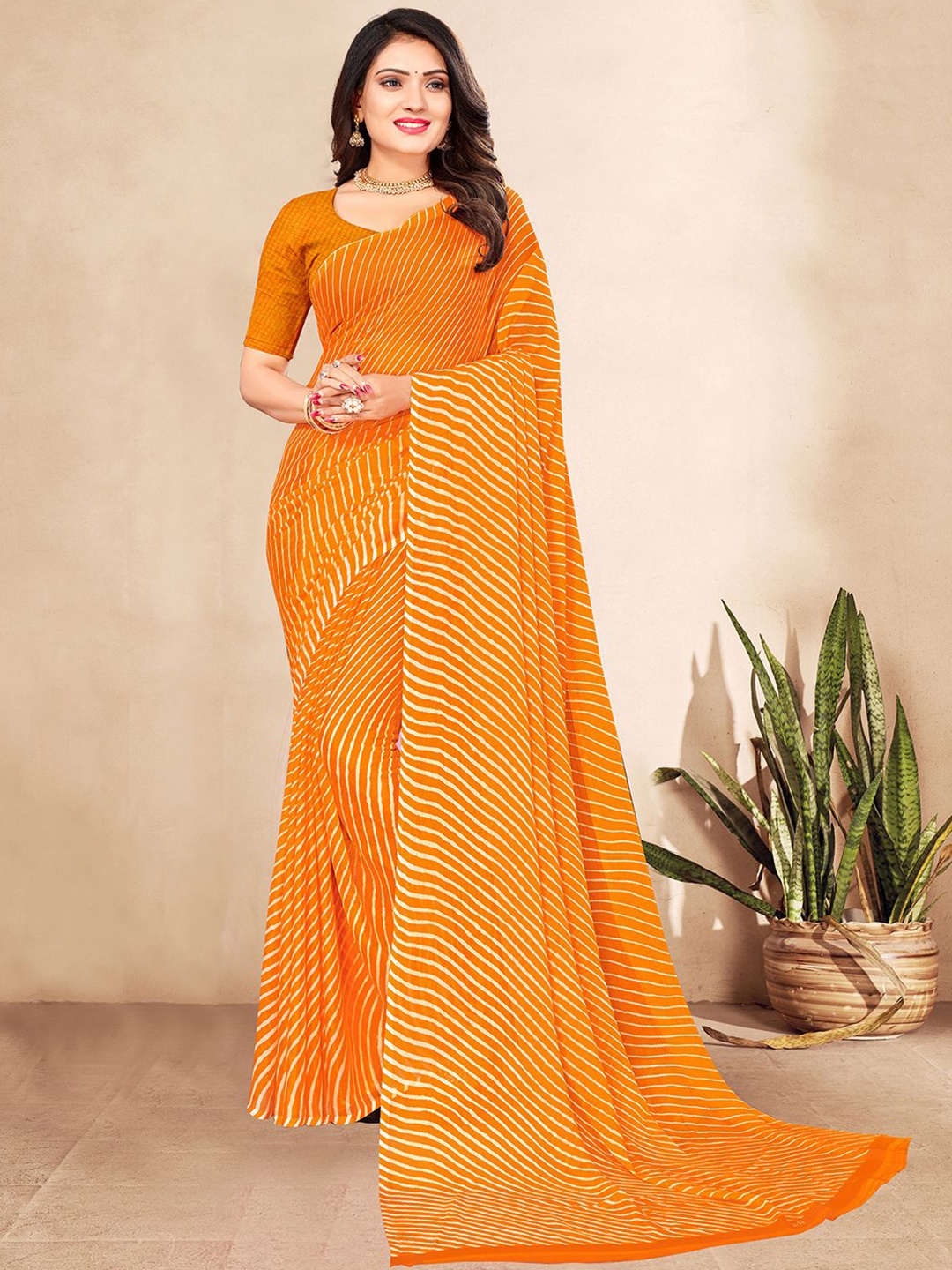

Mitera Orange & White Leheriya Printed Saree