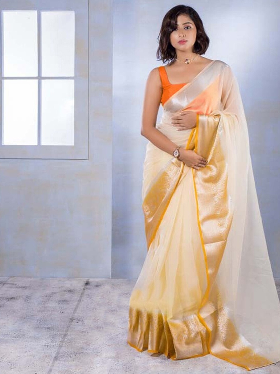 

Mitera Cream & Gold Zari Organza Saree