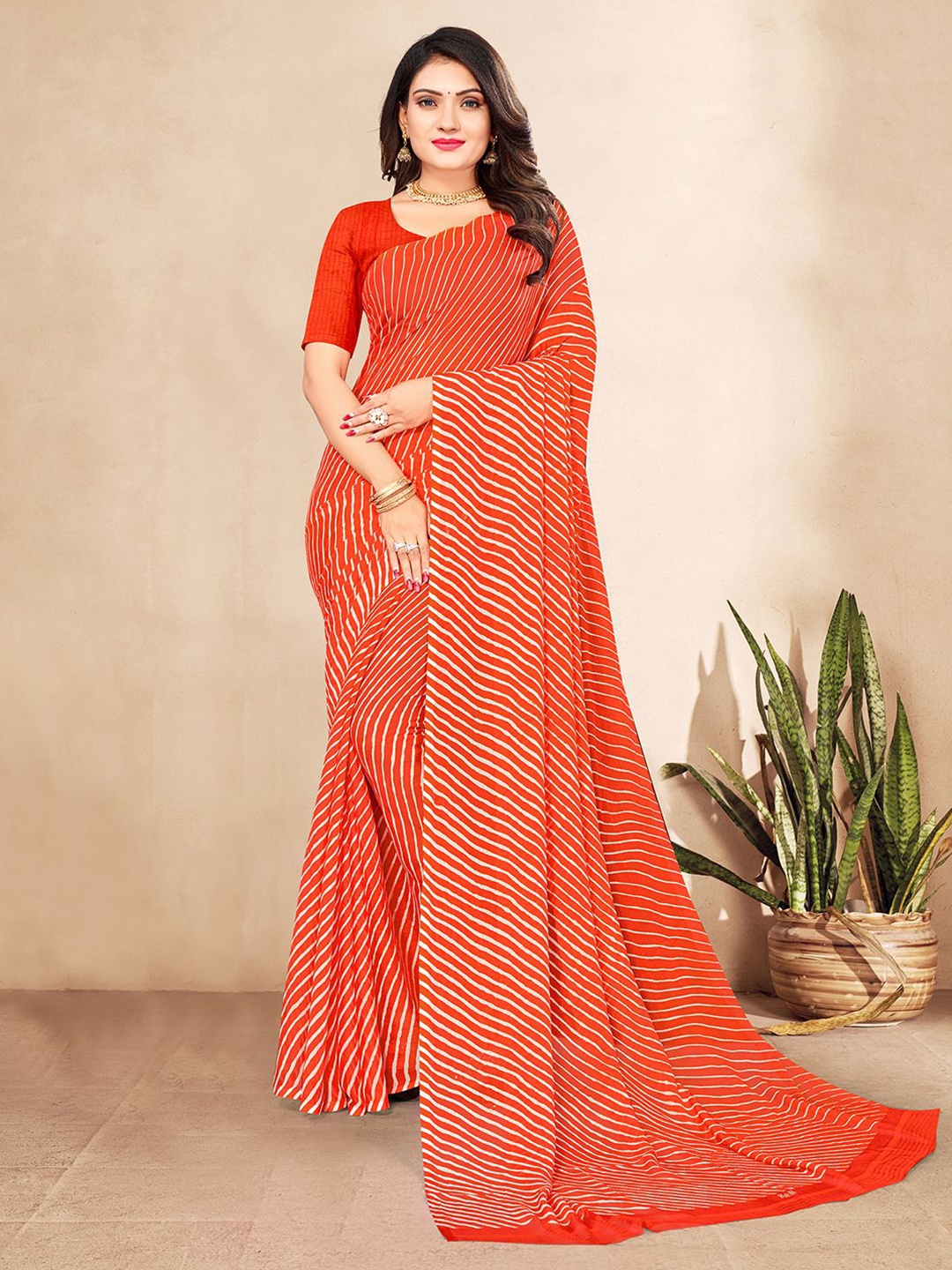 

Mitera Orange & White Leheriya Printed Saree