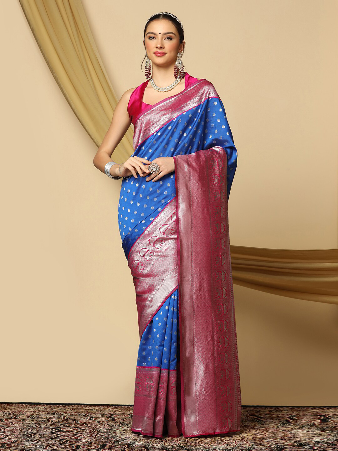 

Mitera Blue & Pink Ethnic Motif Zari Poly Silk Saree