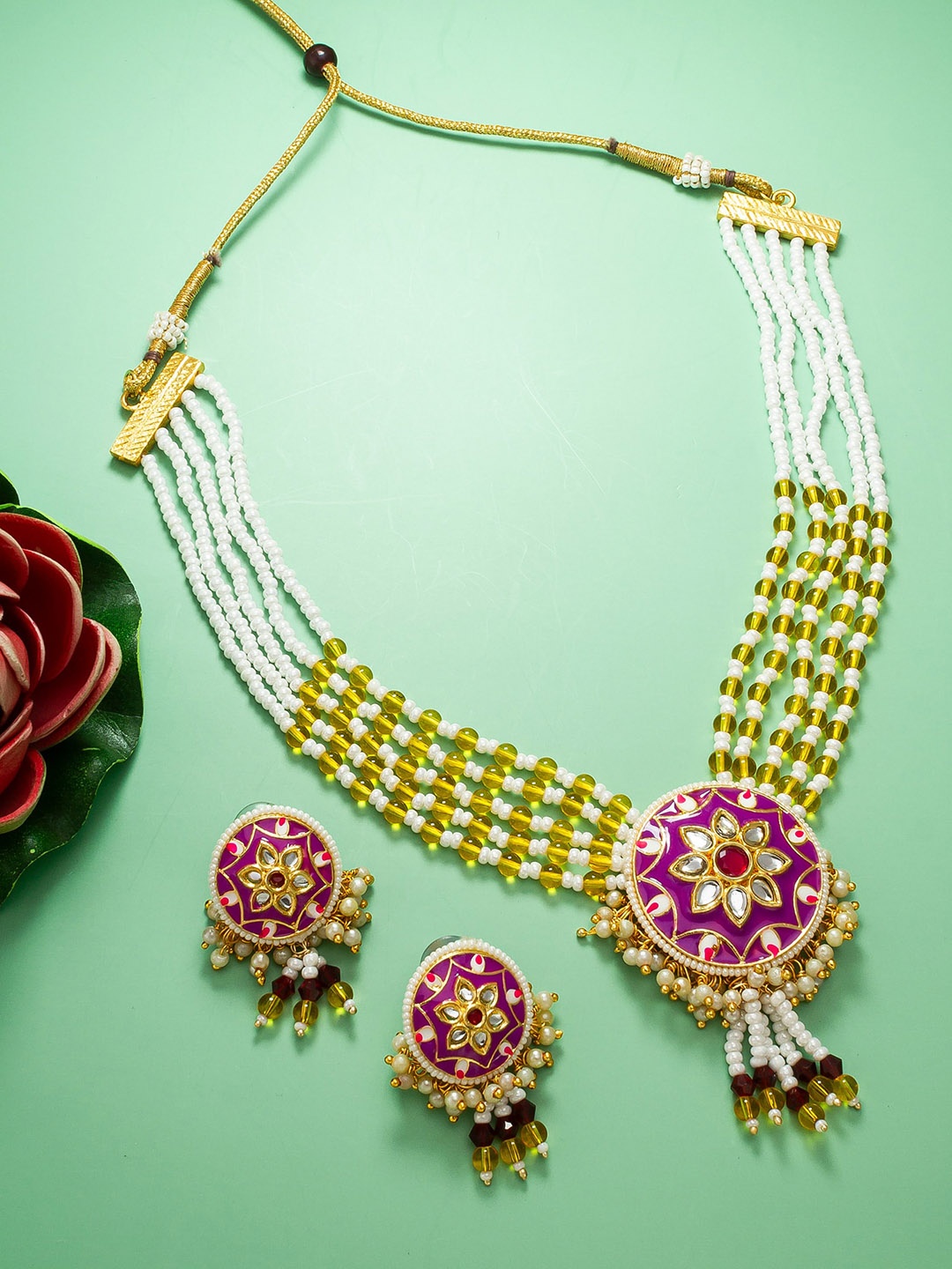 

aadita Gold-Plated Stone-Studded & Beaded Jewellery Set