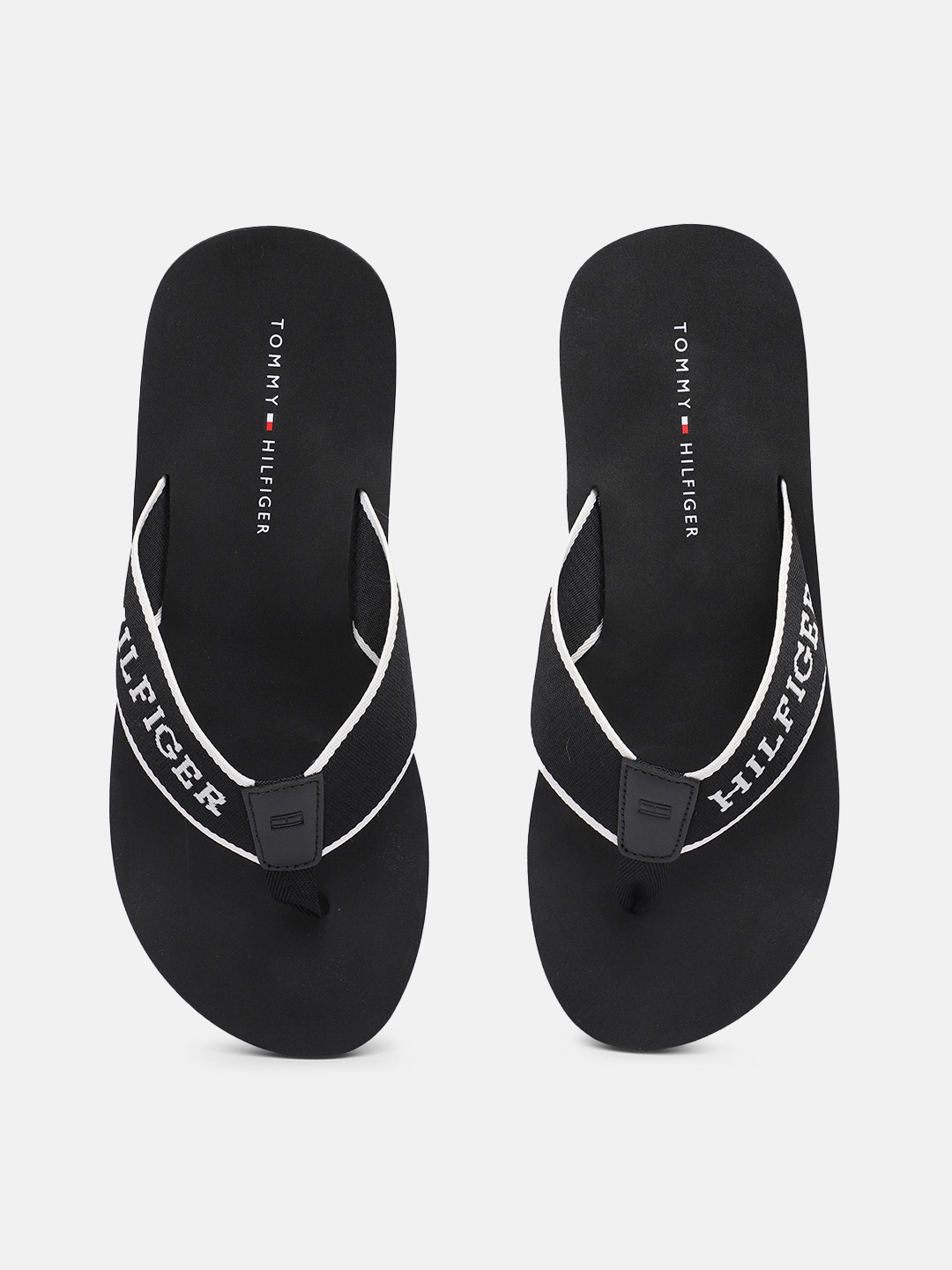 

Tommy Hilfiger Men Brand Logo Printed Thong Flip-Flops, Black