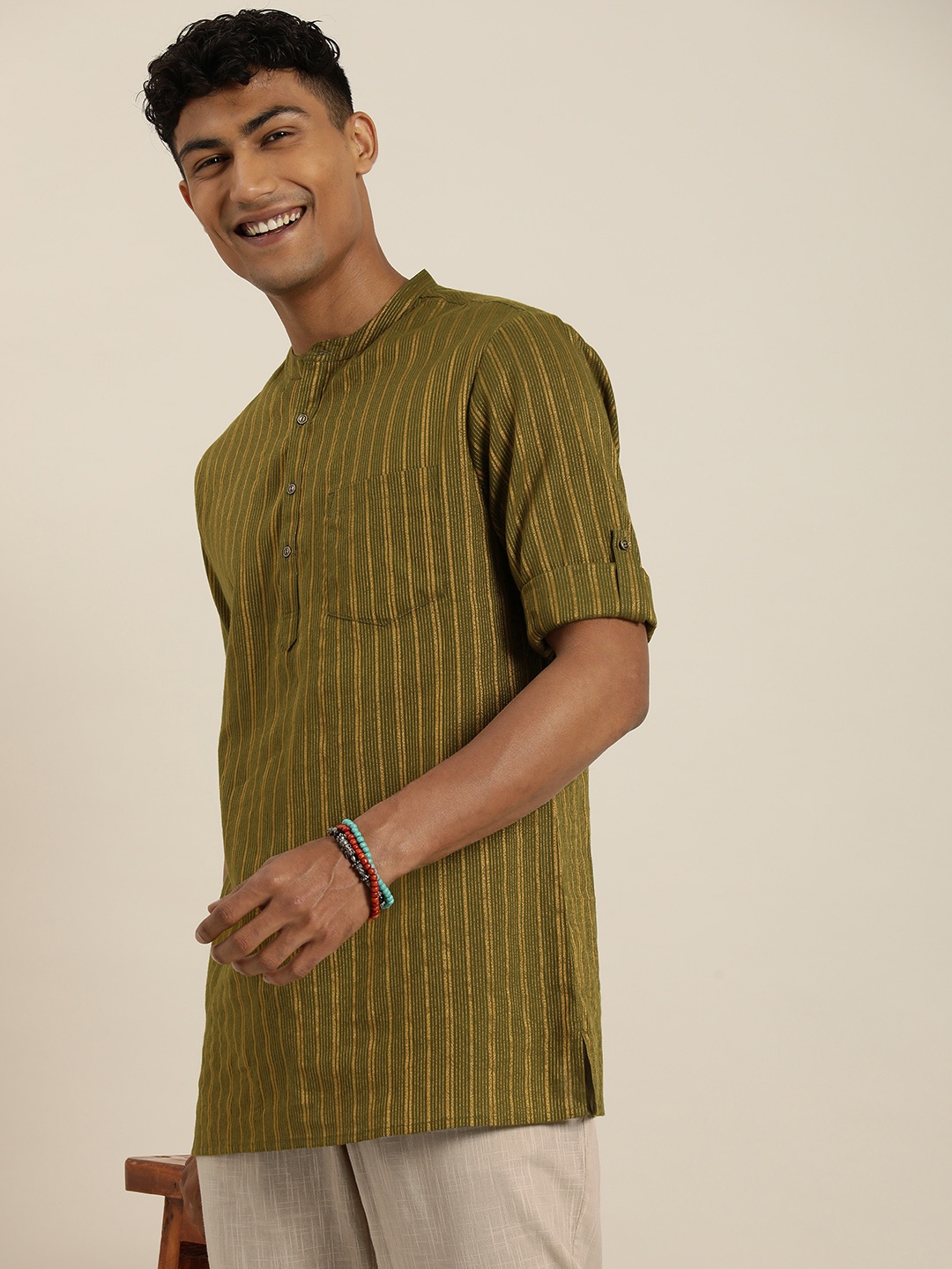 

Taavi Nagari weaves Striped Regular Kurti with Trousers, Olive