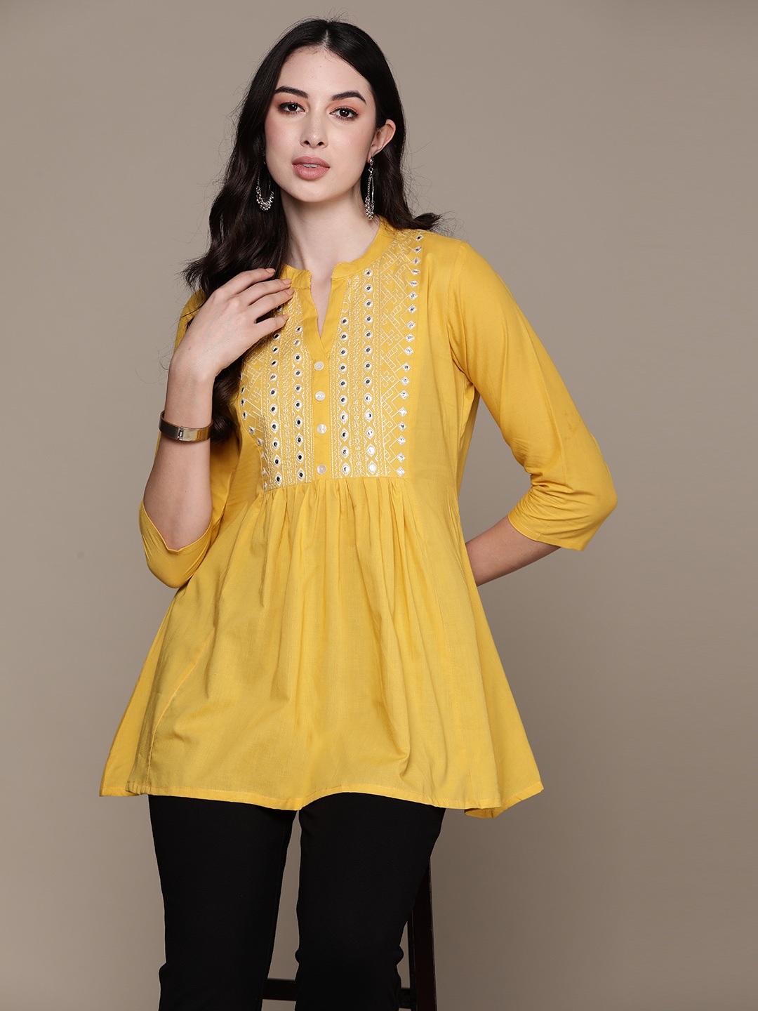 

Anubhutee Yoke Design Mirror Work Pure Cotton Pleated Kurti, Yellow