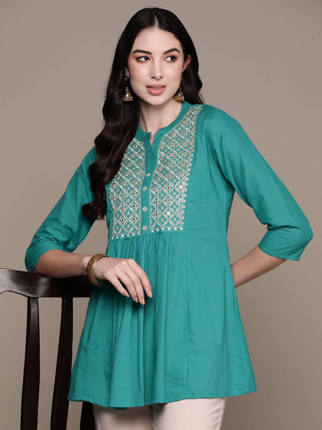 

Anubhutee Floral Yoke Design Mirror Work Pure Cotton Mirror Work Pleated Kurti, Turquoise blue