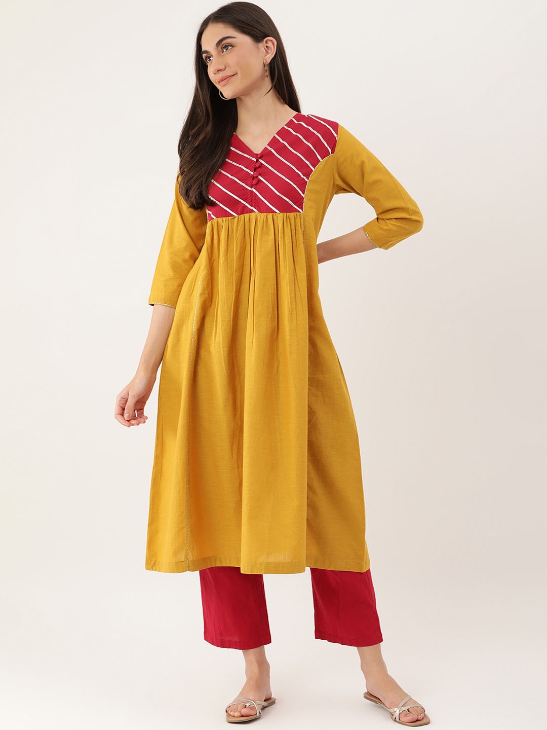 

Lokatita Yoke Design Gota Patti Cotton A-Line Pleated Kurta, Yellow