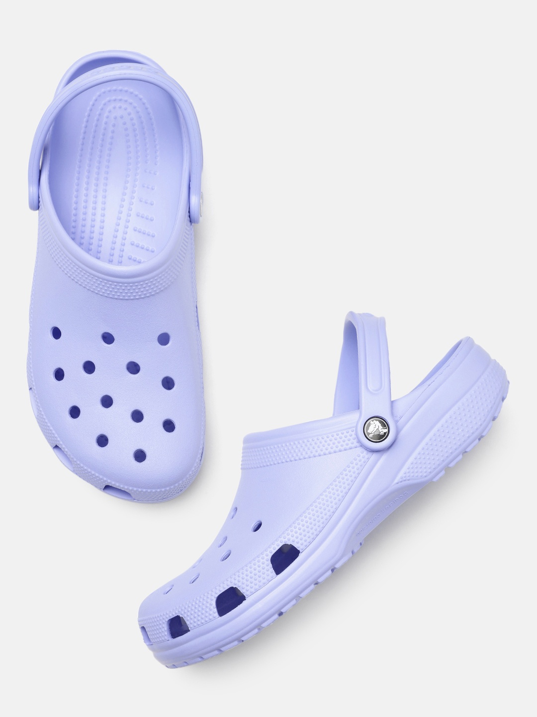 

Crocs Women Solid Croslite Clogs With Laser Cut Detail, Violet