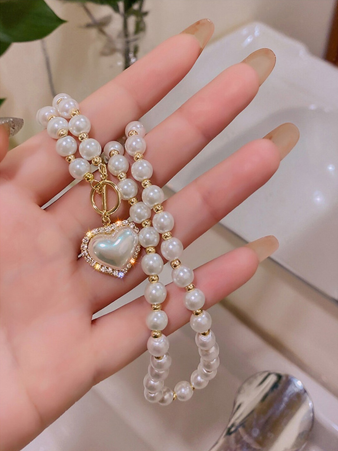 

Scintillare By Sukkhi Gold-Plated Minimal Pearls Heart Shaped Necklace