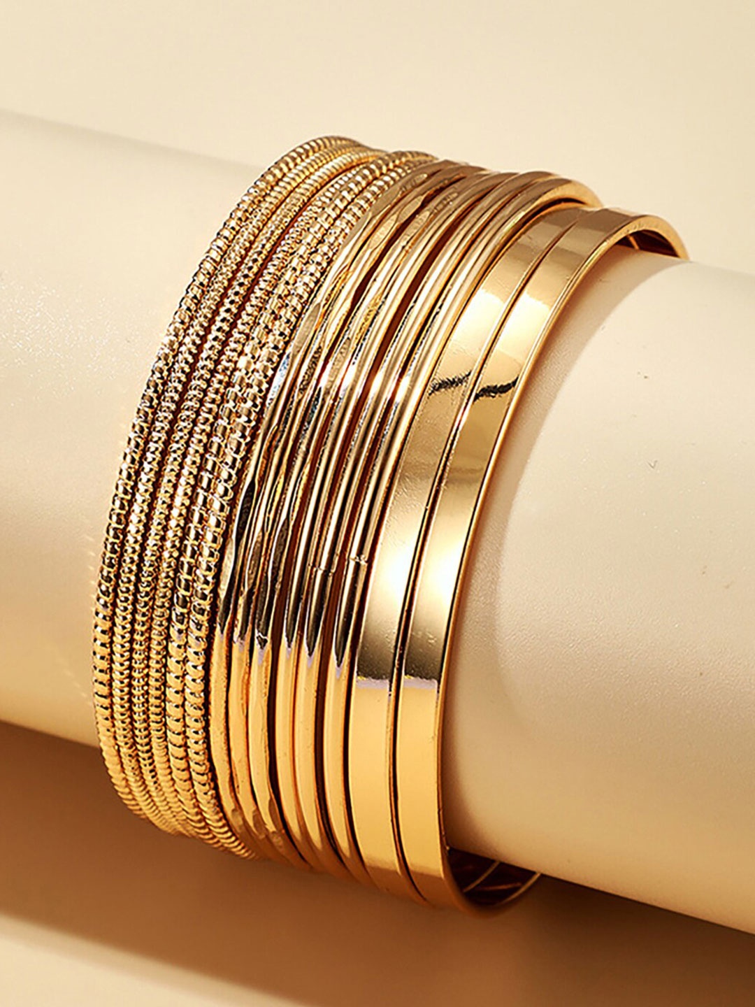 

Scintillare by Sukkhi Set of 14 Gold-Plated Textured Bangles