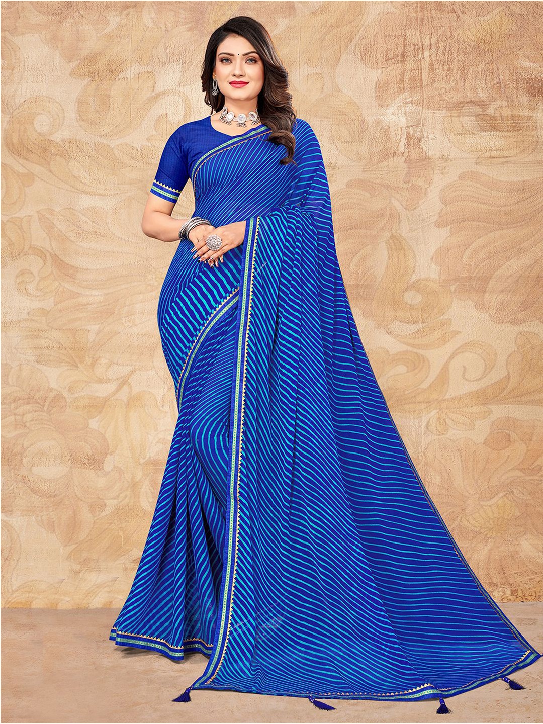

Mitera Blue Leheriya Printed Zari Saree