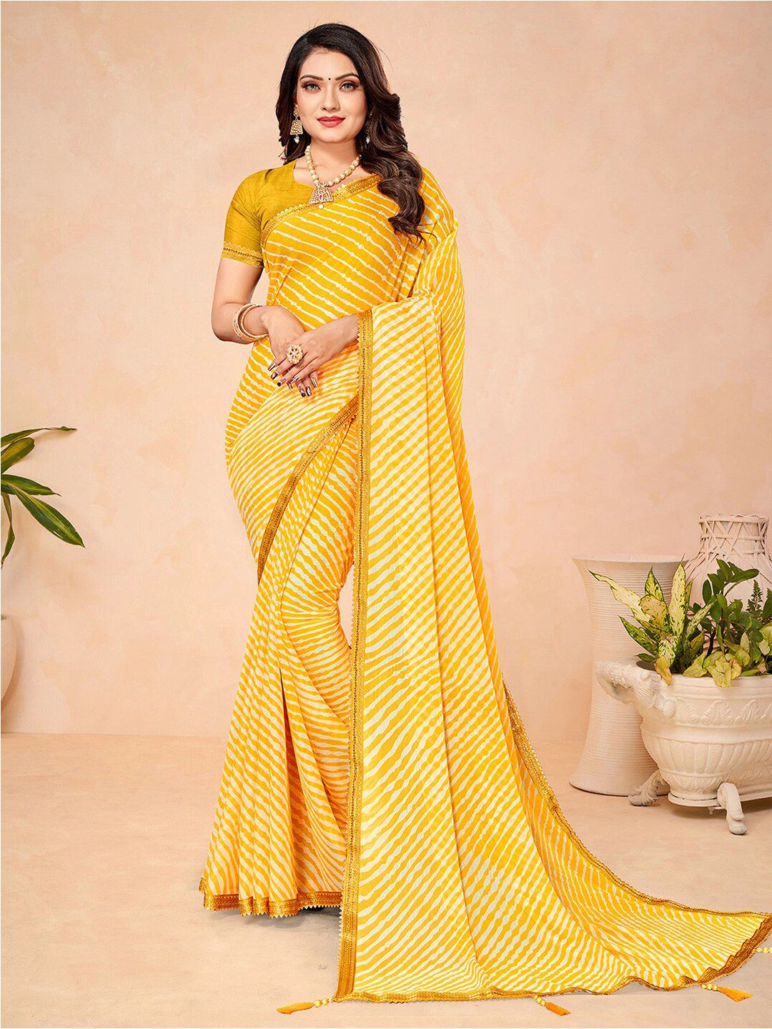 

Mitera Yellow Leheriya Printed Zari Saree