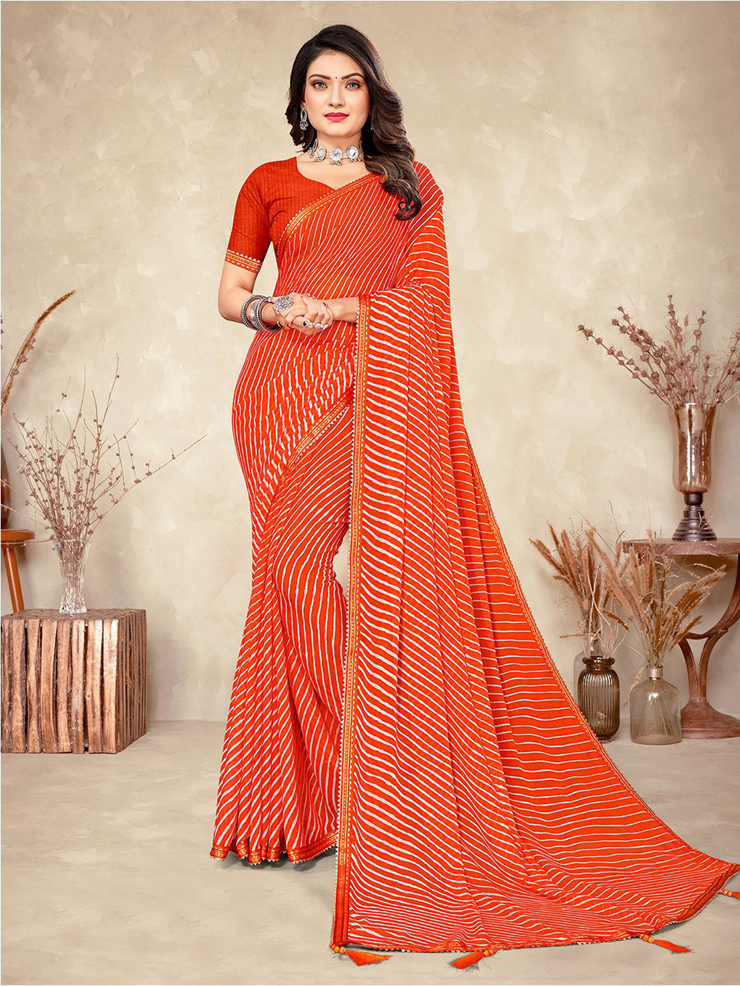 

Mitera Orange & Gold Leheriya Printed Zari Saree